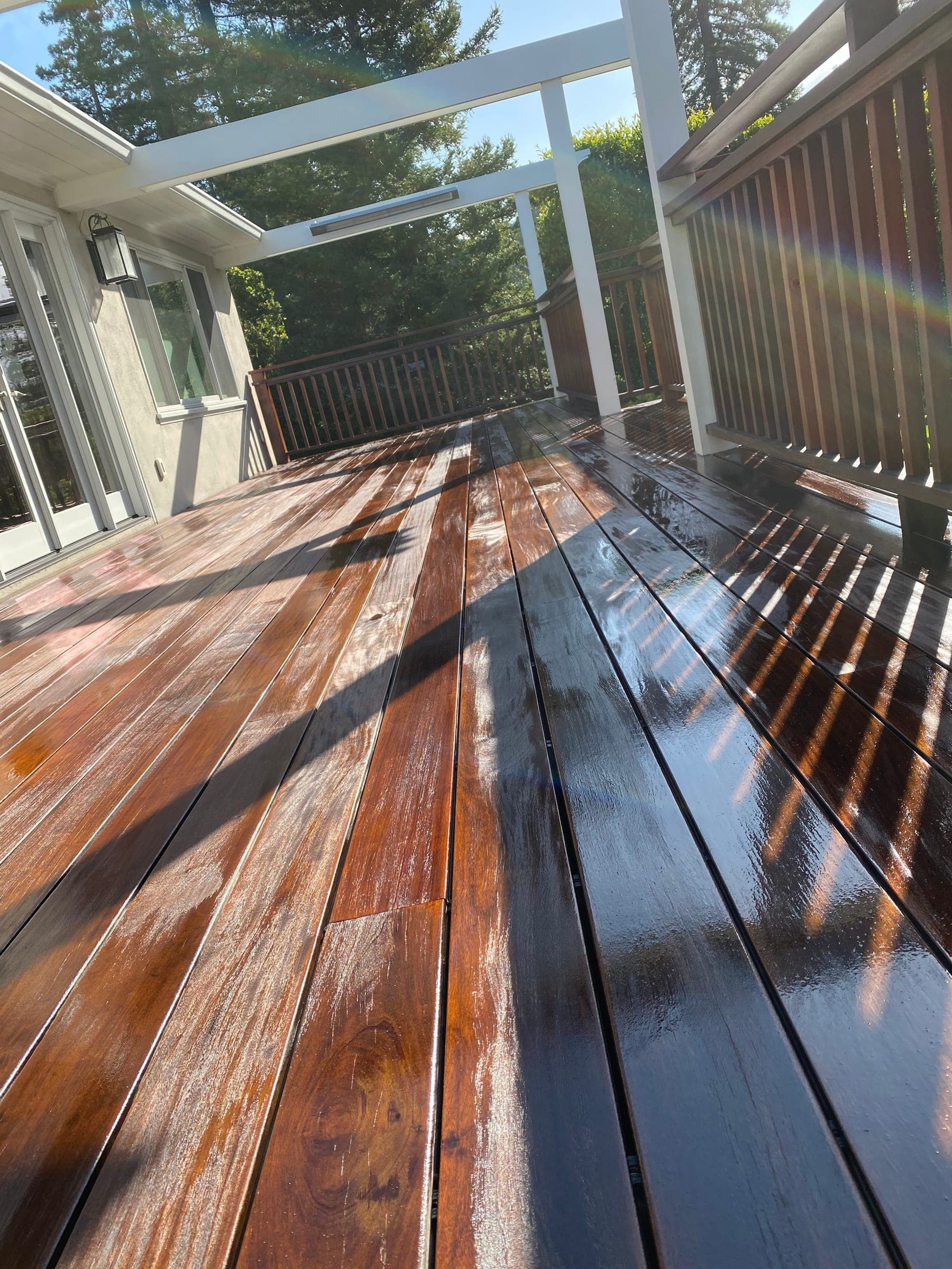 Close view of oiled ipe deck boards glistening in the sun