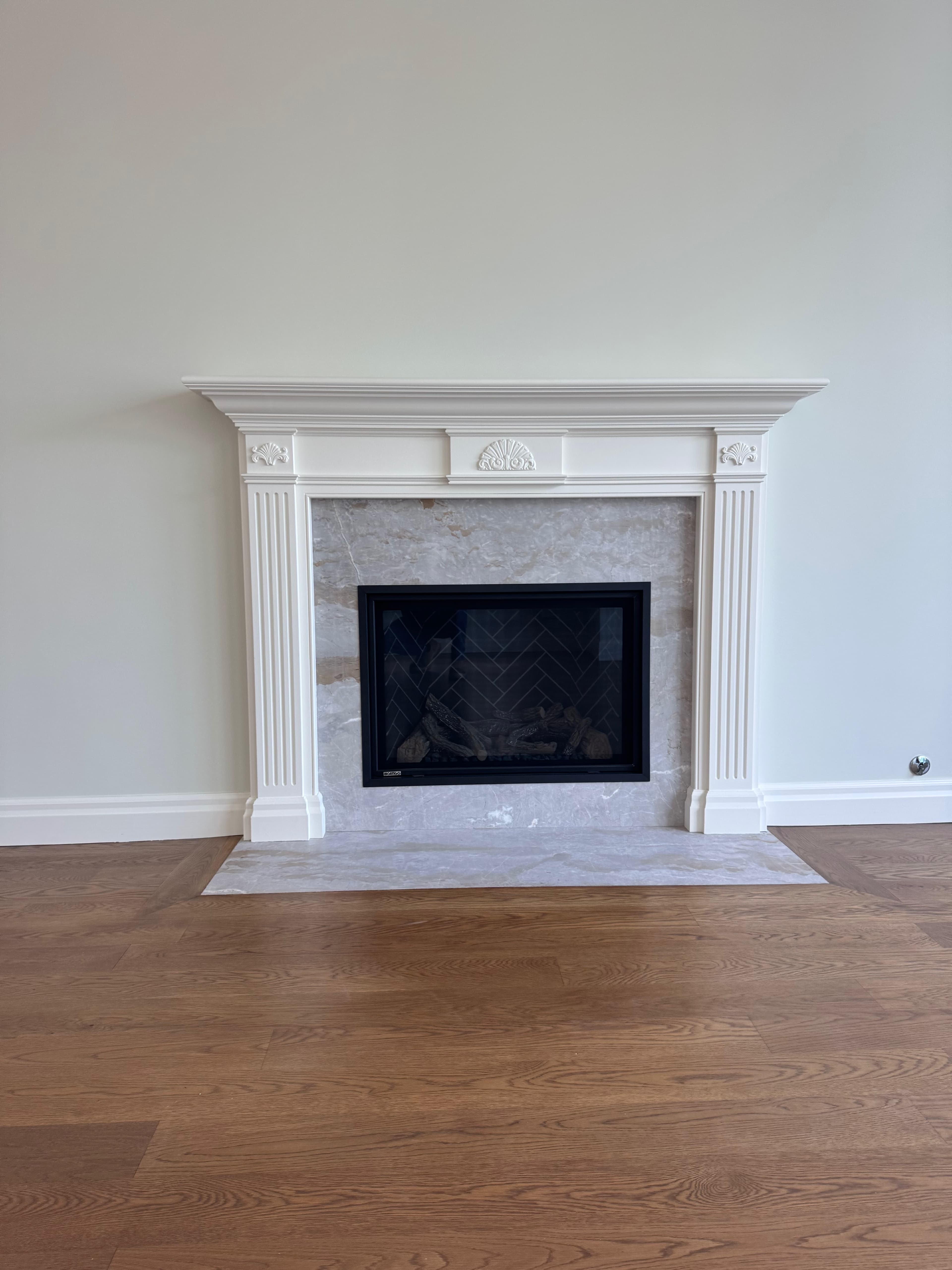 Custom fireplace mantel with fluted legs